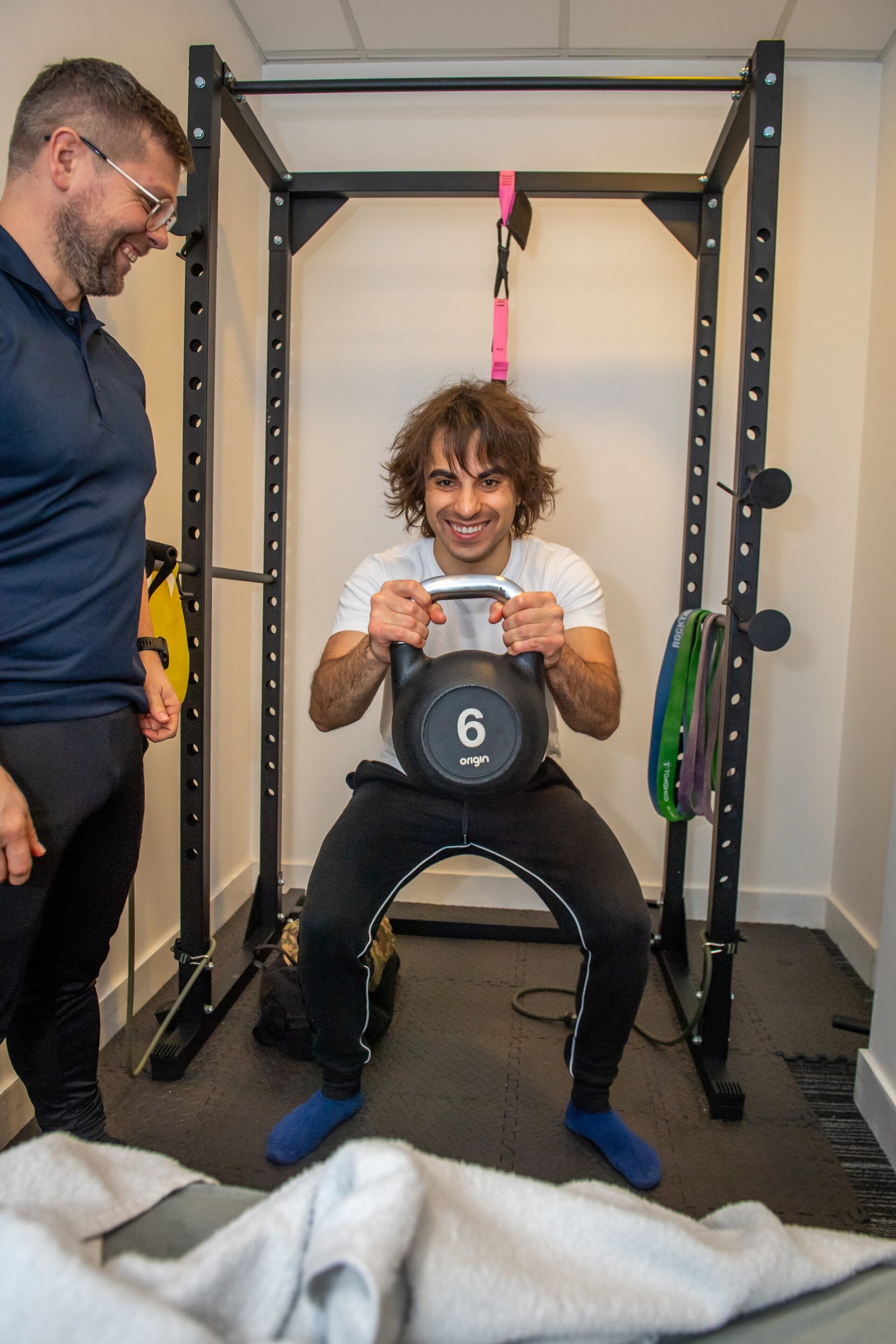 Personal trainer coaching a client during a one-to-one training session in Slough