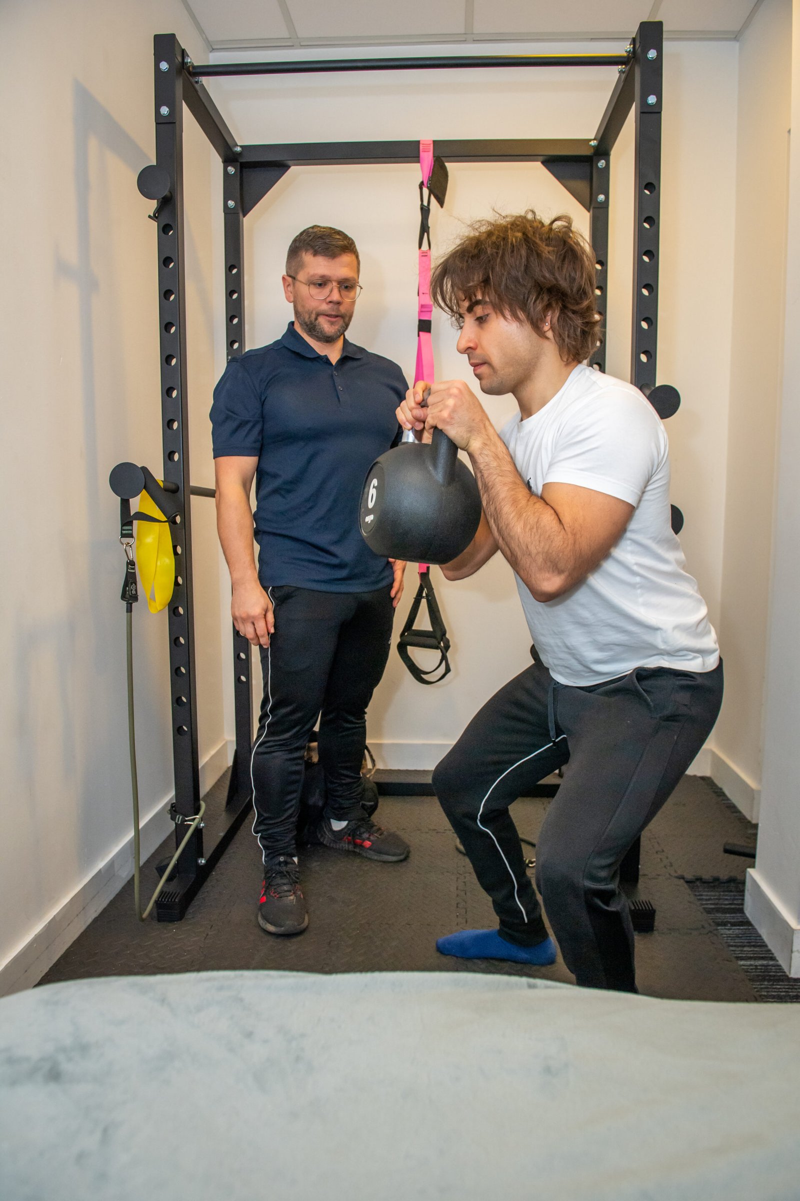 Client performing functional strength exercise during personal training